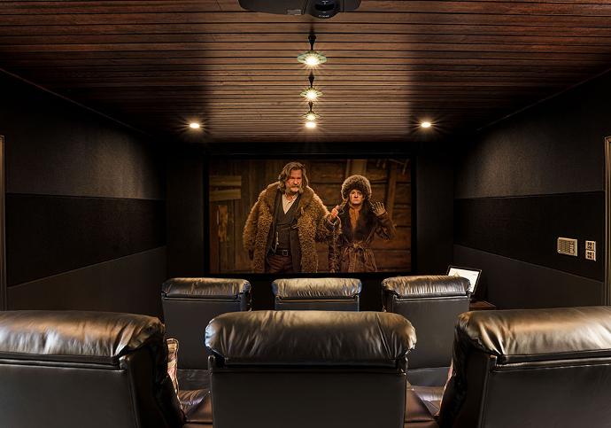 Architectural home cinema room with timber decor