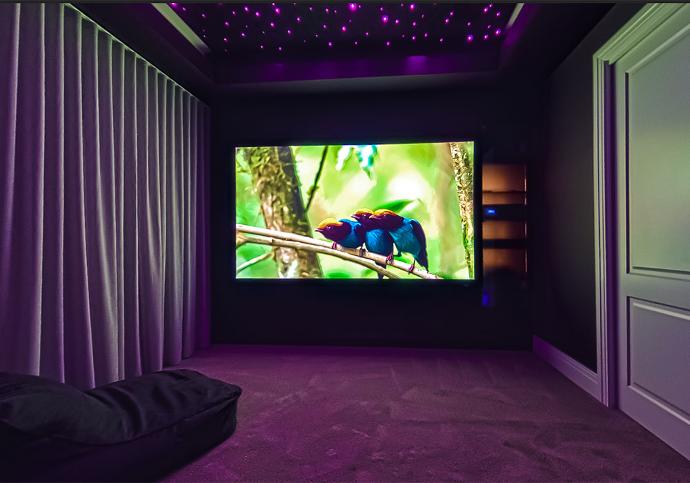 Small home theatre room with concealed speakers
