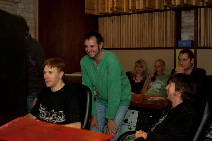 a group of musicians enjoying their studio sessions